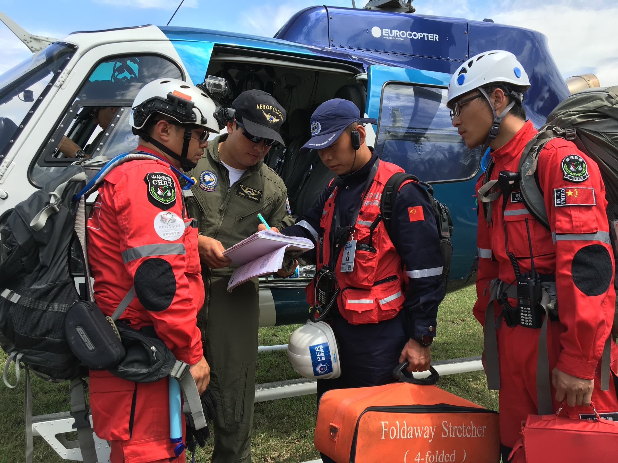 Humanitarian field response personnel preparing medical and logistics equipment.