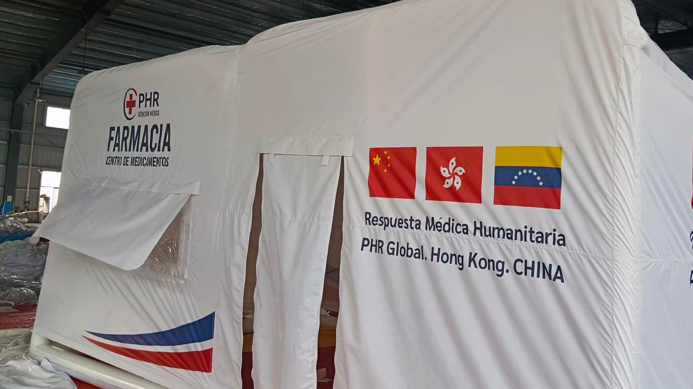 Mobile pharmacy tent marked for humanitarian medical response.